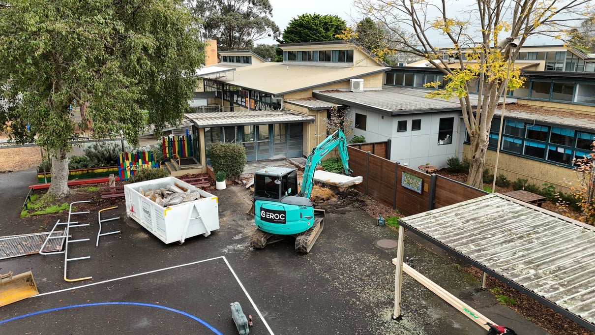 EROC excavator working within an operating school site