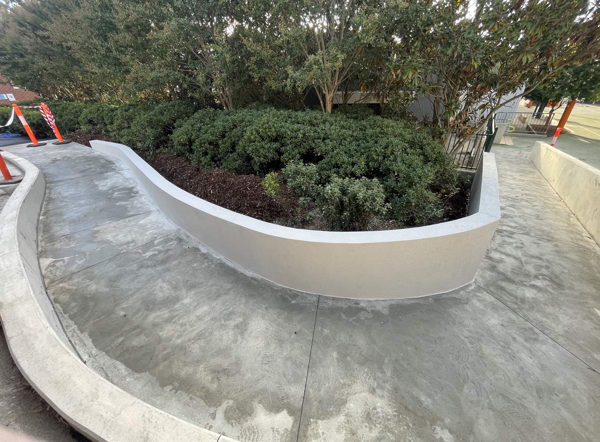 Curved concrete planter walls at Heidelberg Primary School